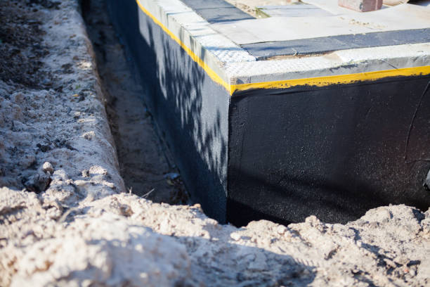 Professional Exterior Waterproofing technician working in Williamsburg, VA